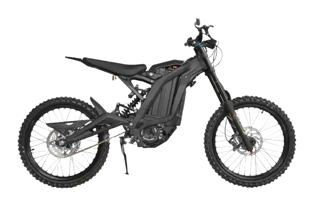 Black electric dirt bike with knobby tires and exposed battery, shown in profile view on a kickstand for off-road use